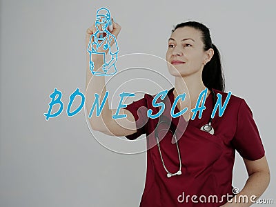 Medic writing BONE SCAN on a transparent virtual interface with a marker pen Stock Photo