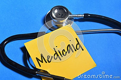 Medicaid wording with stethoscope on blue background. Medical concept Stock Photo