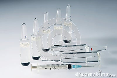 Medical ampoules and syringe Stock Photo