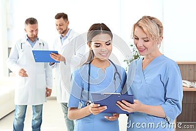 Medical assistants and doctors in clinic Stock Photo