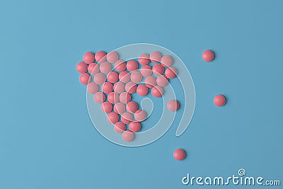 Medical background or banner. Pink Pills in form of broke heart on blue background. Flat lay Stock Photo