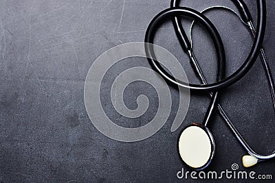 Medical background with stethoscope on blackboard Stock Photo