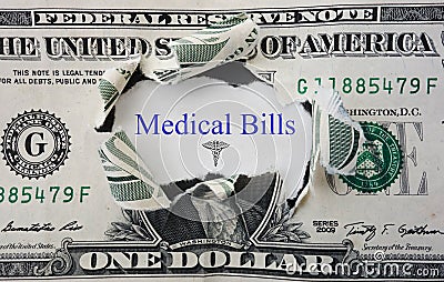 Medical Bills message with torn dollar bill Stock Photo