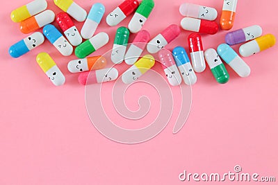 Medical capsules and pills with happy smiling Editorial Stock Photo