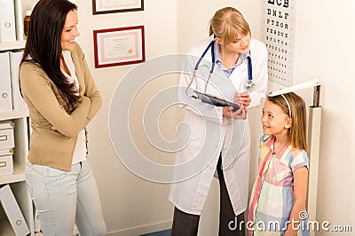 Medical check-up at pediatrist girl measure height Stock Photo