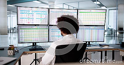 Medical coder analyzes billing codes on hospital computer Stock Photo