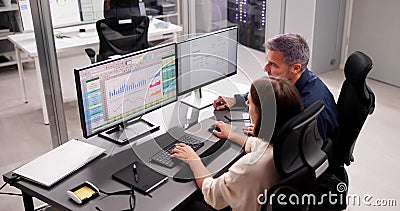 Medical Coder Working on Multiple Spreadsheets Stock Photo