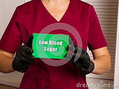 Medical concept about Low Blood Sugar Hypoglycemia with inscription on the sheet Stock Photo