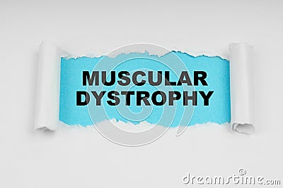 In the middle of a white sheet in space on a blue background the inscription - MUSCULAR DYSTROPHY Stock Photo