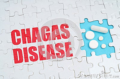 On the puzzles there is an inscription - Chagas disease, on a blue background pills. Stock Photo