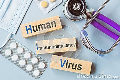 Medical conceptual word collected of wooden elements with the letters. HIV - short for Human Immunodeficiency Virus Stock Photo
