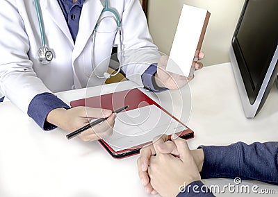 Medical consultation by docter with note. Stock Photo