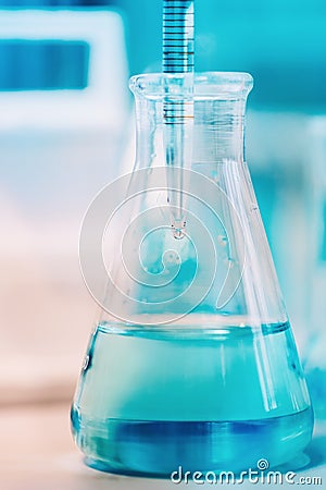 Medical details - Doctor testing probes with pipette in glass container. Close up of scientist using technology Stock Photo