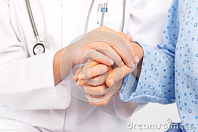 Medical doctor holing senior patient's hand Stock Photo