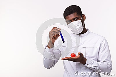 Medical doctor or laborant holding tube with Coronavirus vaccine for COVID-19. Coronavirus model in human hand. Vaccine Stock Photo