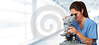 Medical doctor with microscope Stock Photo