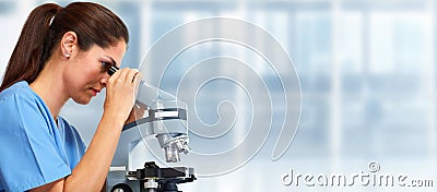 Medical doctor with microscope Stock Photo