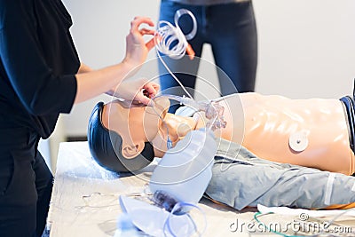 Medical doctor specialist expert displaying method of patient intubation technique on hands on medical education Stock Photo