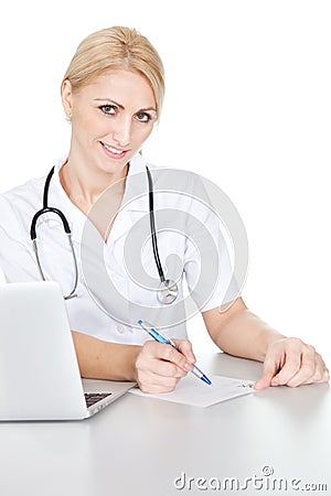 Medical doctor woman filling out prescription Stock Photo