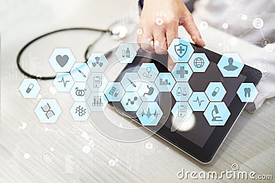 Medical doctor working with modern computer virtual screen interface. Medicine technology and healthcare concept. Stock Photo