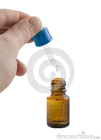 Medical dropper in hands Stock Photo