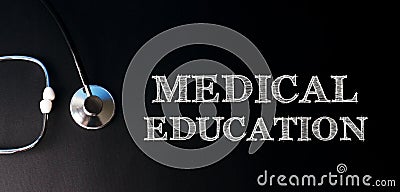 MEDICAL EDUCATION written in chalk on a dark background along with a stethoscope. Health care medicine concept. Top view, flat lay Stock Photo