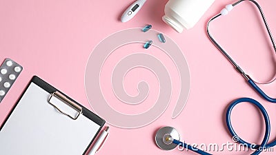 Medical equipment on pink background. Top view doctors table desk with medical clipboard, pen, pills, thermometer, stethoscope. Stock Photo