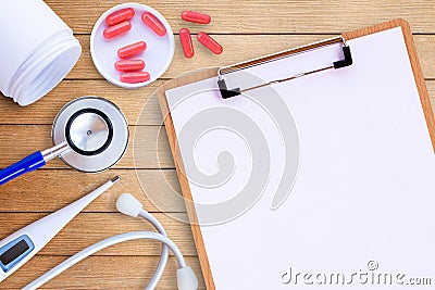 Medical equipment on wooden doctor desk background Stock Photo
