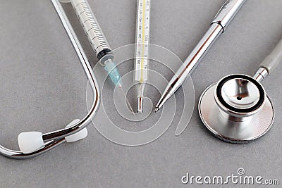 Medical equipments including stethoscope, syringe, medicines background, top view flat lay Stock Photo