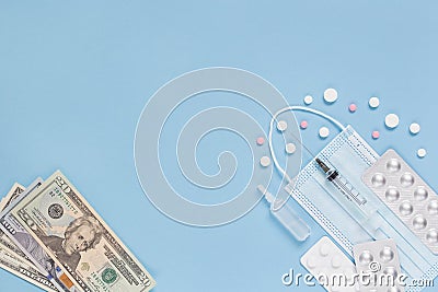 Medical face mask, packaging with pills, expendable syringe, ampulla and paper money. The concept of insurance medicine Stock Photo