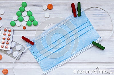 Medical flatlay with colourful pills and mask. New year medical concept. Stock Photo
