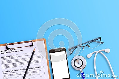 Medical form with smart phone and blue stethoscop on wooden desk Stock Photo
