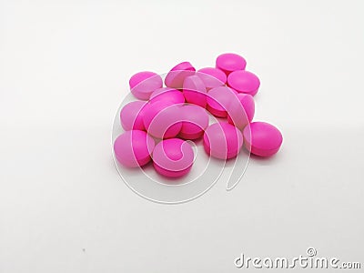 Medical and healthcare concept. Many round pink tablets of Erythromycin 250 mg. isolated on white background, used to treat or pr Stock Photo