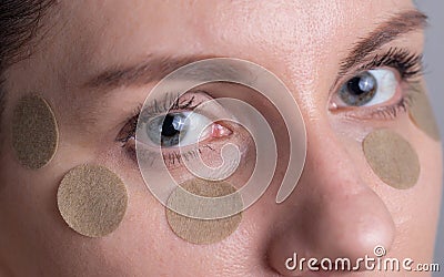 Medical herbal patch for the girl around the eyes to remove bags under the eyes and improve vision, macro Stock Photo