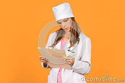 Medical history prescription. Woman work at clinic. Doctor with stethoscope at hospital. Girl with folder. Medical Stock Photo