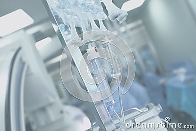 Medical IV drip systems on a background of the operating room Stock Photo