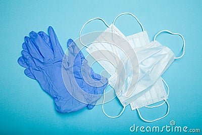 Medical mask and gloves. Blue background. Stock Photo