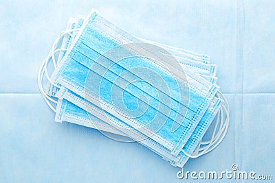 Medical mask, surgical protective masks on blue background. Disposable face mask cover the mouth and nose. Healthcare and medical Stock Photo