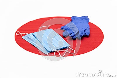 Medical masks, gloves are on the background of the Japanese flag Stock Photo