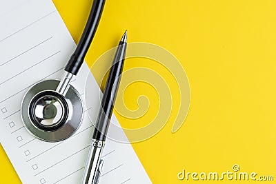 Medical note, prescription, checklist or recommendation from expertise or doctor, pen, stethoscope on small notepad with checkbox Stock Photo