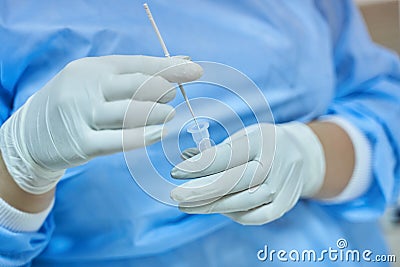 Nurse Mixing COVID-19 Rapid Test Swab Stock Photo