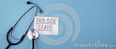 Medical phonendoscope with the inscription paid sick leave on a blue background Stock Photo