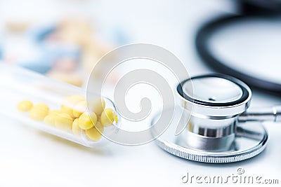 Medical pills and stetoscope Stock Photo