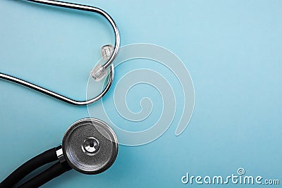 Medical pressure gauge and stethoscope on light blue background, for heart listening, isolated place for text Stock Photo
