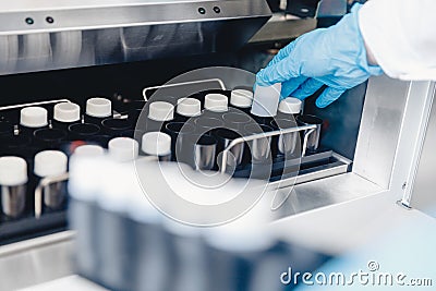 Medical professional places samples in sperm bank for storage and analysis. Concept cloning Stock Photo