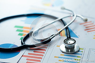 Medical statistics and graphic charts with stethoscope Stock Photo