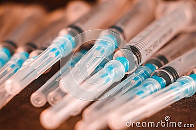 Medical Sterile Syringes Needles, Close up Syringes on wooden Background, Health care concept. Stock Photo