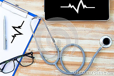 A medical stethoscope near a laptop Stock Photo