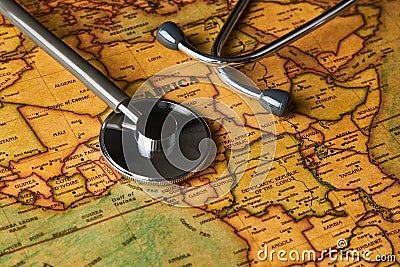 Medical stethoscope over africa healthcheck. close-up map Stock Photo