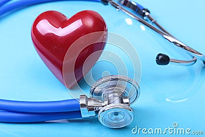 Medical stethoscope and red heart on blue mirror background. you can place your text. Stock Photo